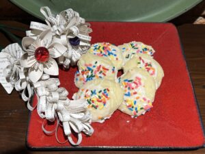 book page flowers next to six anise cookies which were desert for the book club soup swap