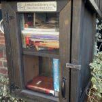 Little Free Library brown box with books inside that we found on our Little Free Library Crawl in Philadelphia